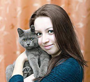 Young woman buys energy healing for her beloved cat